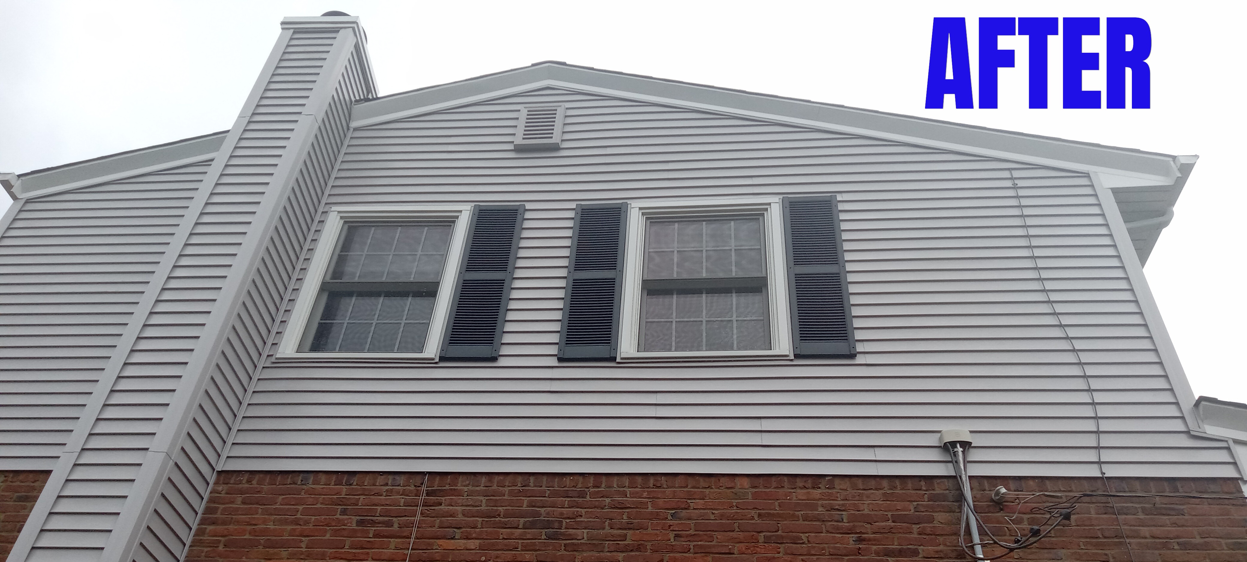 The same house after a soft wash house cleaning. The algae growth is gone.