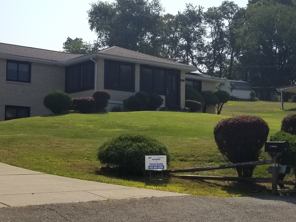 A Pittsburgh-area home that has just received driveway cleaning and sidewalk cleaning services from So Clean Solutions.