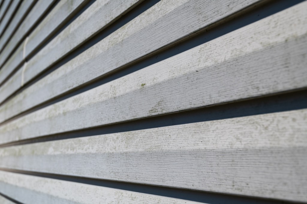 A Pittsburgh-area home's vinyl siding has been soiled by soot due to smoke from Canadian wildfires.